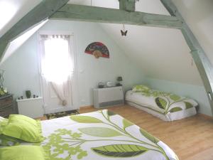 Postel nebo postele na pokoji v ubytování Maison d'Hôtes La Quèrière