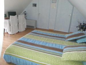 Postel nebo postele na pokoji v ubytování Maison d'Hôtes La Quèrière