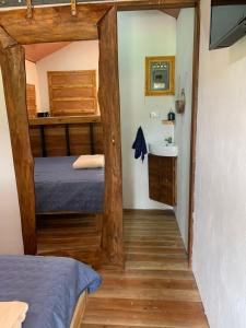 a room with two bunk beds and a sink at Cabañas del Bosque in Nandayure