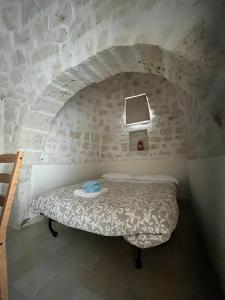 Postel nebo postele na pokoji v ubytování Trulli bella vite