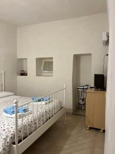 Postel nebo postele na pokoji v ubytování Trulli bella vite