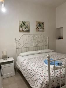 Postel nebo postele na pokoji v ubytování Trulli bella vite