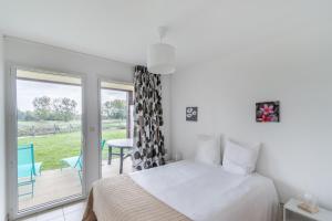 Postel nebo postele na pokoji v ubytování Le Backspin - Appt 6p accès piscine, spa, sauna