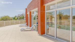 Balkón nebo terasa v ubytování Le Backspin - Appt 6p accès piscine, spa, sauna
