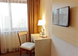 TV a/nebo společenská místnost v ubytování Hotel Ganita Weil am Rhein