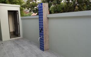 a blue tile wall next to a door at Private Pool Villa with Jacuzzi at Royal Park Village - Walk to the Beach - MAX 3 ADULT MALES in Jomtien Beach