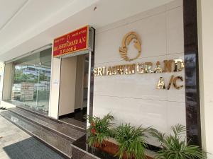 a building with a sign that reads australian cancer at Sri Aswin Grand in Nāmakkal