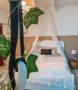 a bedroom with a bed with a canopy at Douro Rural Suite in Porto