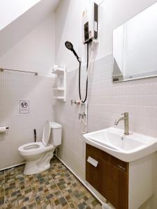 a bathroom with a toilet and a sink at Lively and cozy canal house ,Entire house in Bangkok