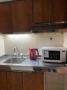 Kuchyň nebo kuchyňský kout v ubytování Portillo Apartments