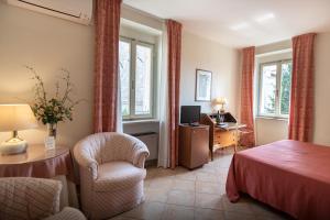 Postel nebo postele na pokoji v ubytování Hotel Umbra