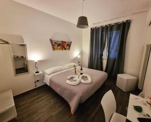 Postel nebo postele na pokoji v ubytování Residenza Tarzanà