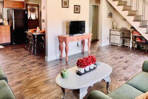 a living room with a table and a kitchen at Ashtabula Home Near Walnut Beach and Eateries! in Ashtabula