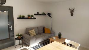 a living room with a couch and a table at Enjoy Winterberg in Winterberg