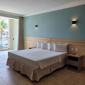 Postel nebo postele na pokoji v ubytování Porto Mar Hotel