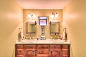 a bathroom with two sinks and two mirrors at Luxe Twin Lakes House with Mountain and Lake Views! in Twin Lakes +33 photos