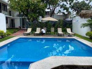 Bazén v ubytování Hotel fresno Xochitepec nebo v jeho okolí