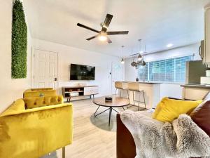a living room with a couch and a ceiling fan at Quiet Remodeled 3 Bedroom in Heart of Downtown Sacramento in Sacramento