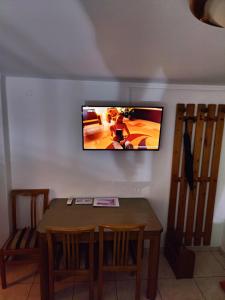A television and/or entertainment centre at Art apartment Syngrou