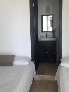 Postel nebo postele na pokoji v ubytování Hotel fresno Xochitepec
