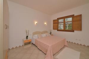 A bed or beds in a room at Residence Le Zagare