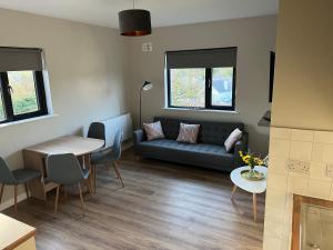 a living room with a couch and a table at Top of the Town No.5 in Cootehill