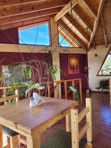 a wooden table with a cat sitting on top of it at Ruca Nel in El Calafate