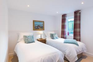 Säng eller sängar i ett rum på Croft Cottage