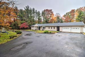 a house with a parking lot in front of it at Pocono Home with Hot Tub, Fireplace and Game Room! in Saylorsburg