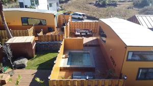 an aerial view of a house with a swimming pool at Morning Beach Pension in Jeju