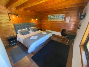 Postel nebo postele na pokoji v ubytování Hotel Andes Pucón