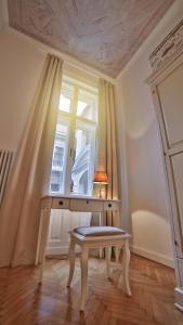 a dressing table in a room with a window at Nadi's Home – Heart of Budapest in Budapest