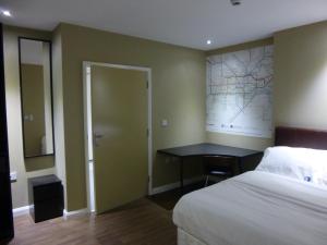 Postel nebo postele na pokoji v ubytování Dreams Hotel