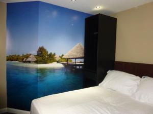 Postel nebo postele na pokoji v ubytování Dreams Hotel