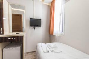 Postel nebo postele na pokoji v ubytování Ottoman Time Hotel