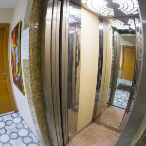 a row of mirrors in a hallway in a building at Ottoman Time Hotel in Istanbul