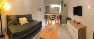 a living room with a couch and a table at Alumine in Puerto Madryn