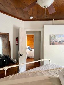 a bedroom with a bed with a wooden ceiling at Pennoli Bed and Breakfast in Gatesville