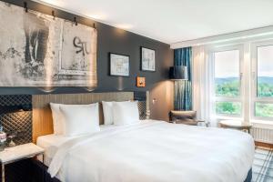 Ένα ή περισσότερα κρεβάτια σε δωμάτιο στο Radisson Blu Hotel Karlsruhe