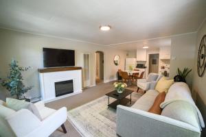 a living room with a couch and a fireplace at Adorable and Cozy Bungalow in Great Falls