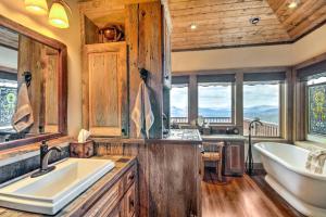 a bathroom with a tub and a sink and a bath tub at Luxury Sapphire Cabin Mtn Views and Resort Access! in Sapphire +25 photos