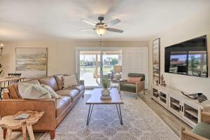 a living room with a couch and a tv at Stunning Sun Lakes Retreat Less Than 1 Mi to Golfing! in Sun Lakes
