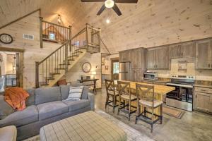 a living room with a couch and a table at Stunning Cabin Getaway with Private Hot Tub! in Rising Fawn +23 photos