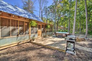 a house with a deck and a pool table at Stunning Cabin Getaway with Private Hot Tub! in Rising Fawn