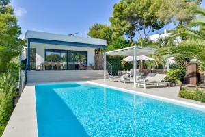 a swimming pool in front of a house at Buenavista by Almarina Villas in Benissa