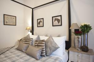 Un pat sau paturi într-o cameră la Town House 62