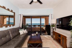 a living room with a couch and a table at Marina Pinacate B-201 in Puerto Peñasco