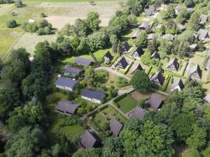 an overhead view of a village with houses and trees at Detached, tidy bungalow on Katzenbuckel mountain in Waldbrunn