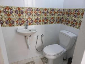 a bathroom with a toilet and a sink at DAR Jamila à 8021 Béni khalled Tunisie in Dawwār al Frinine +20 photos