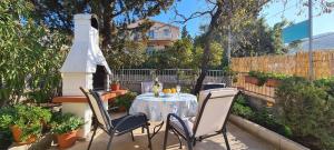 a table and chairs sitting on a patio at Apartment Close to the beach in Stari Grad
